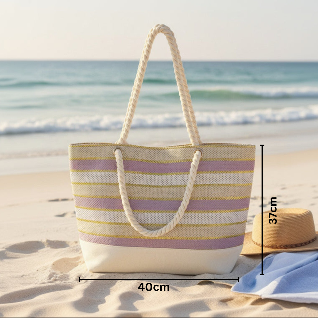 Striped beach bag on a sandy beach with ocean view, dimensions displayed