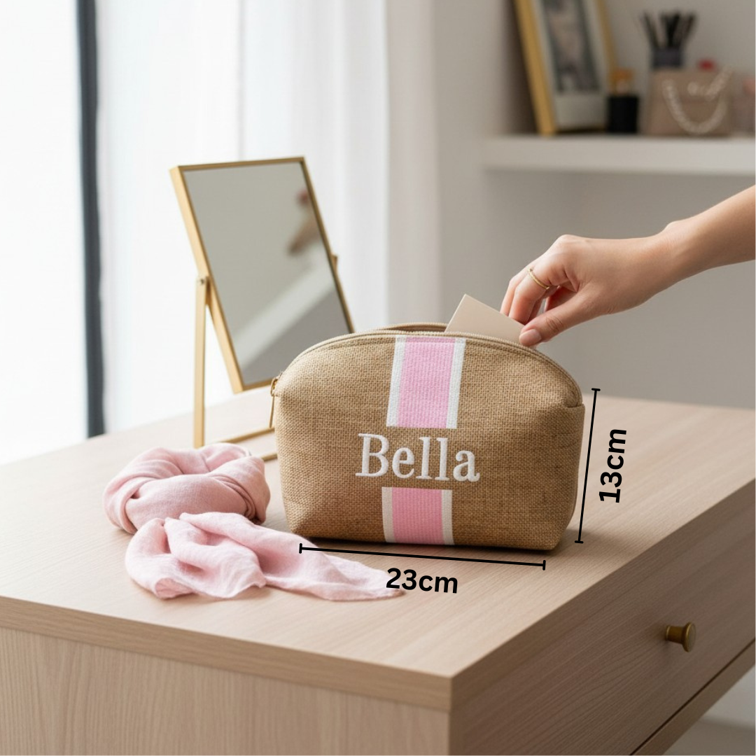 Cosmetic bag with 'Bella' branding on a dresser next to a mirror