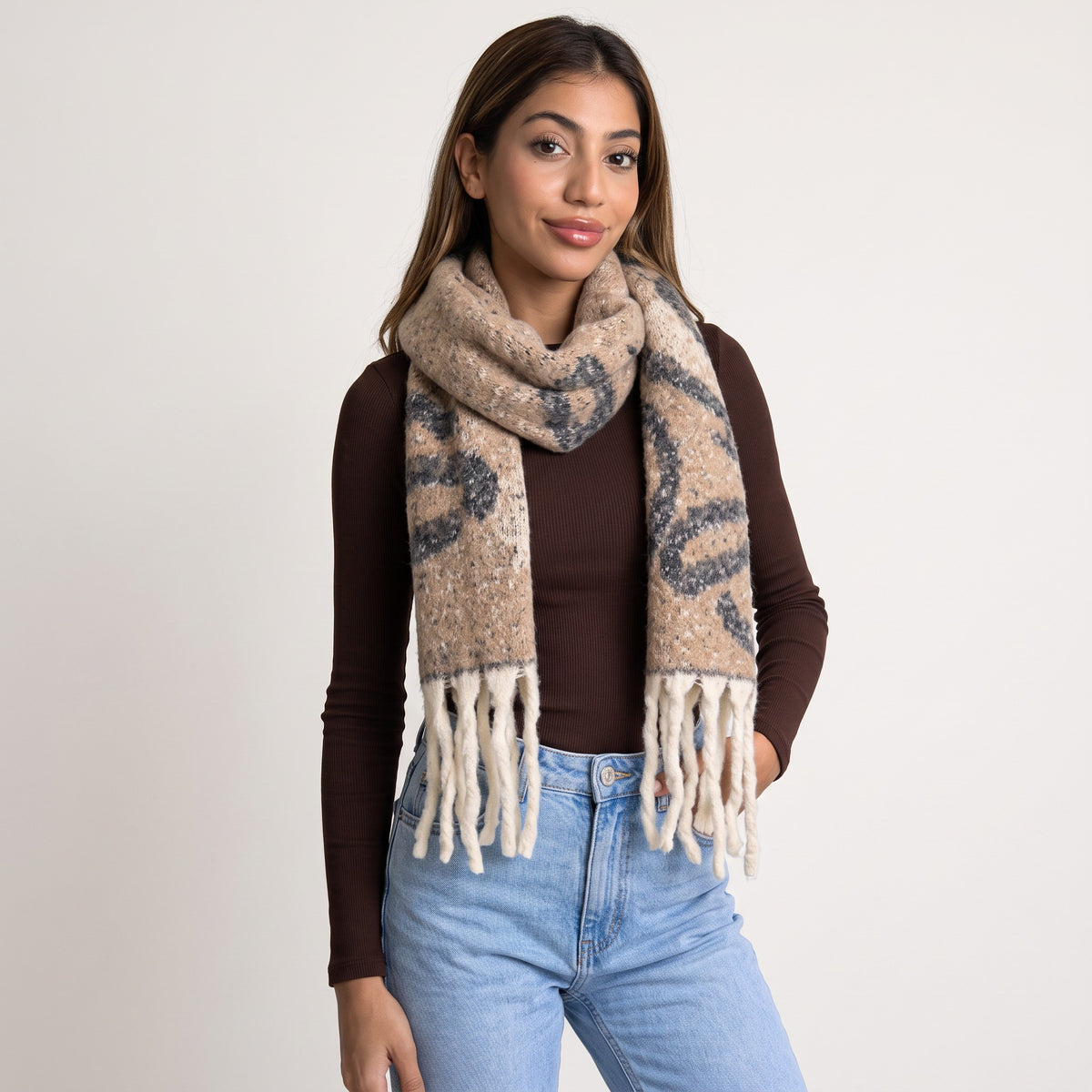 Beige brushed knit scarf with charcoal abstract swirls and long cream twisted fringe