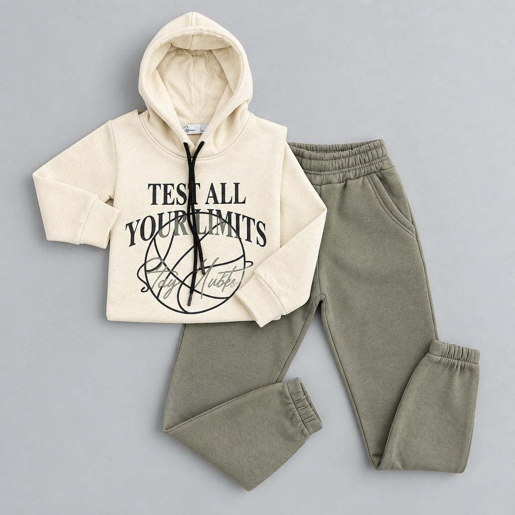 Cream hoodie with Test All Your Limits print laid out with army green joggers