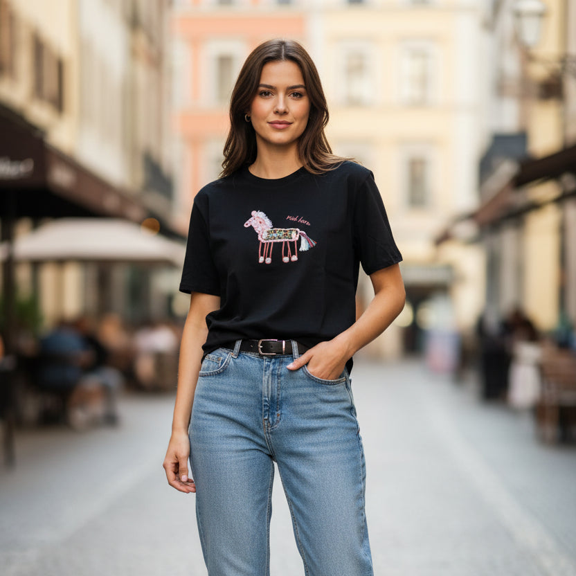 Black tshirt with a llama graphic design worn outdoors