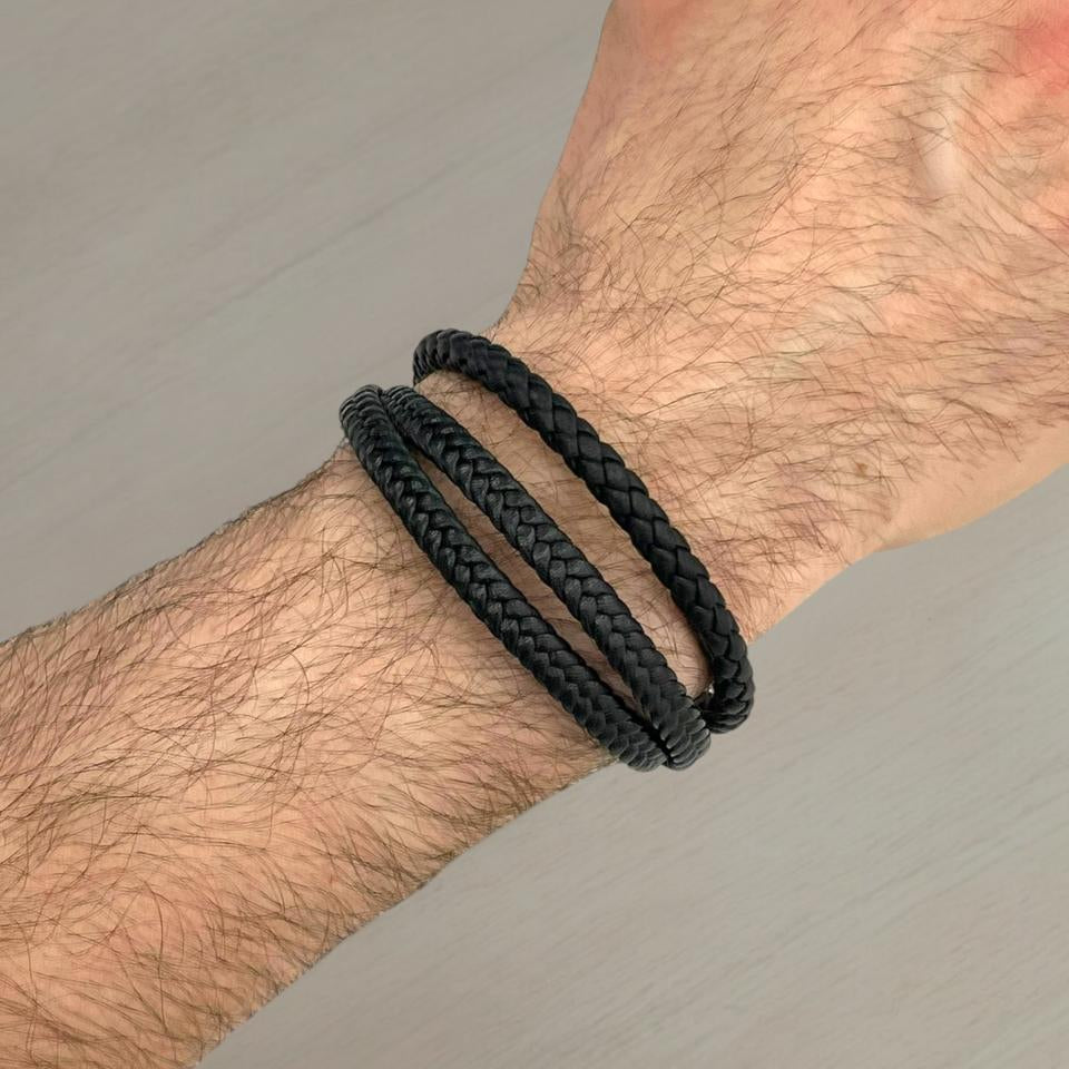 Three thin braided black leather bracelets worn on a wrist, Jack Gifts Online Lebanon