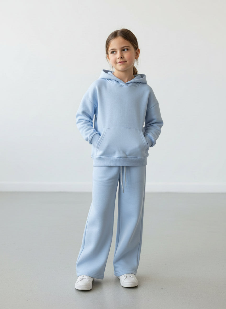 Girl in a light blue fleece hoodie and matching wide leg pants