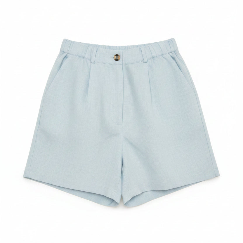 Blue linen shorts on a plain white background