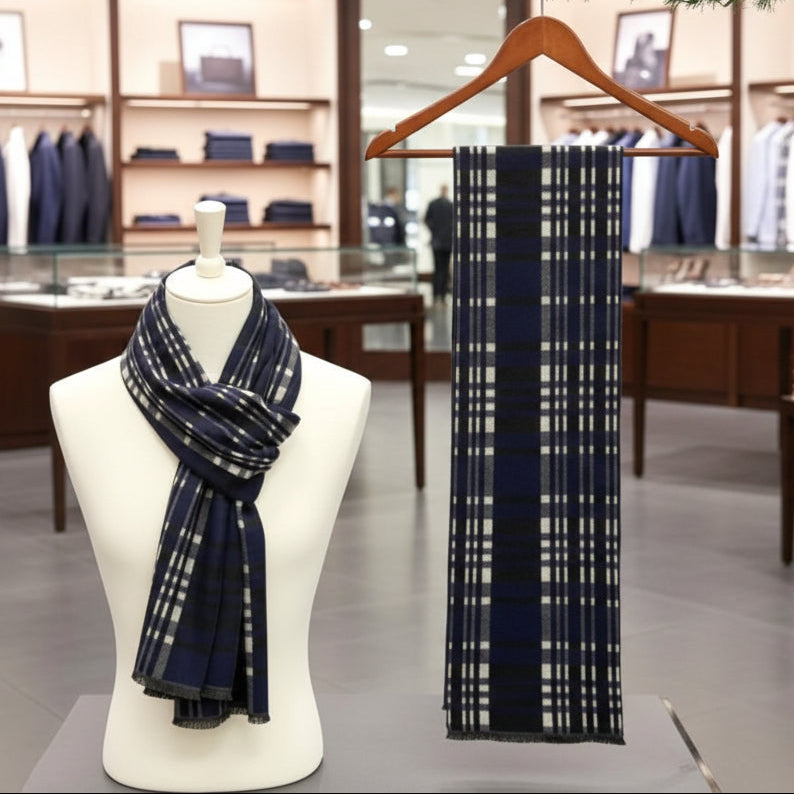 Navy blue plaid scarf on a mannequin and hanger in a store setting