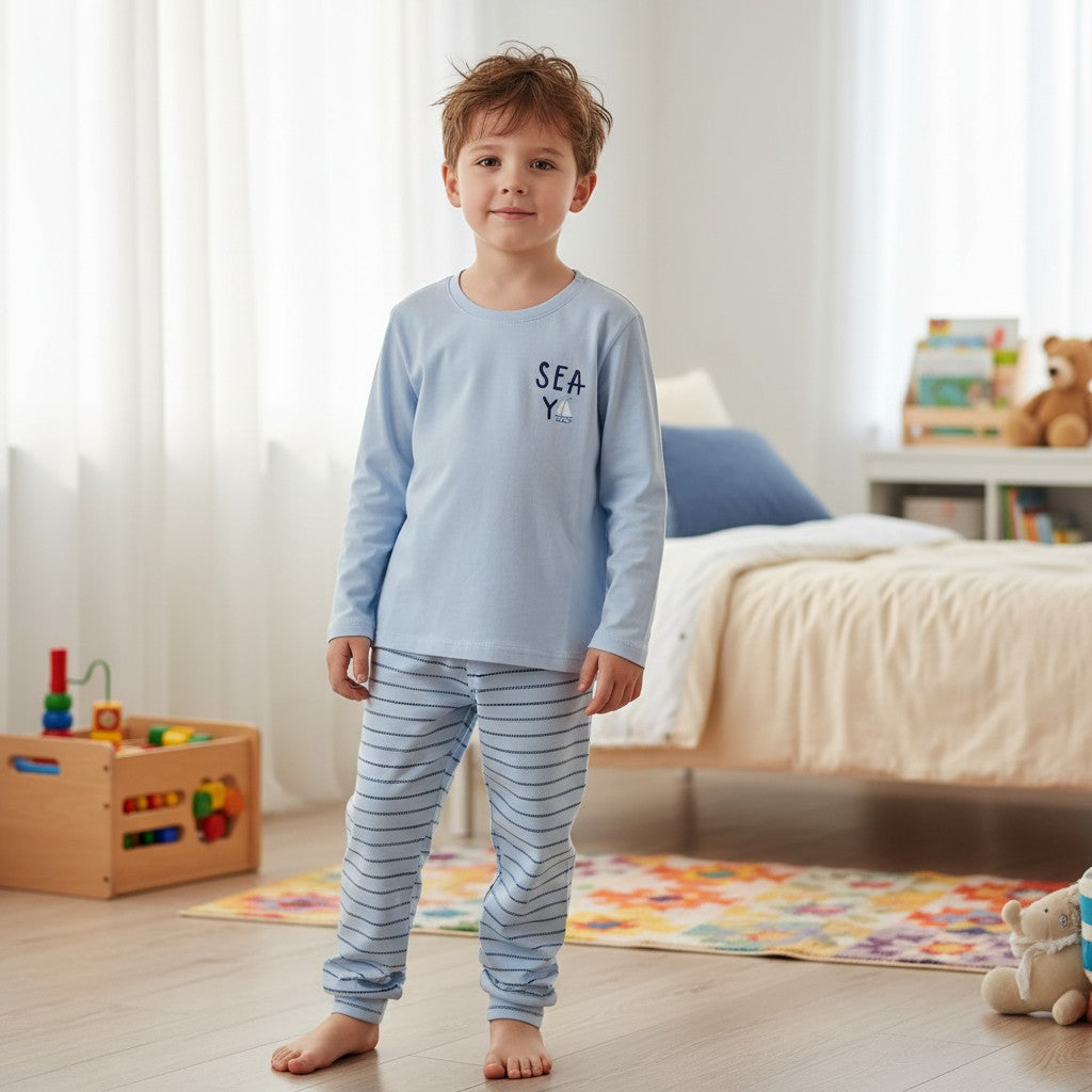 Boy in a light blue pyjama top with sailboat motif and striped pants, Jack Gifts Online Lebanon