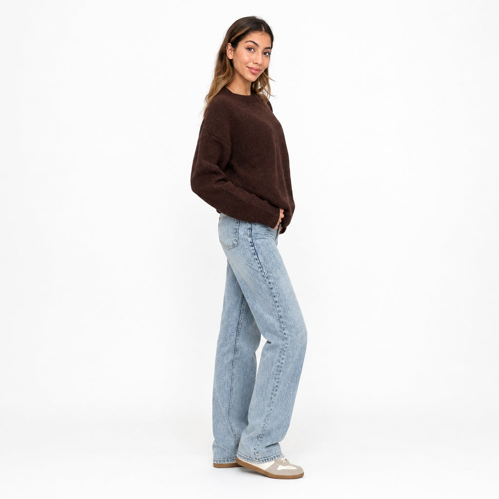 Side view of a brown brushed knit sweater with straight leg jeans, full length