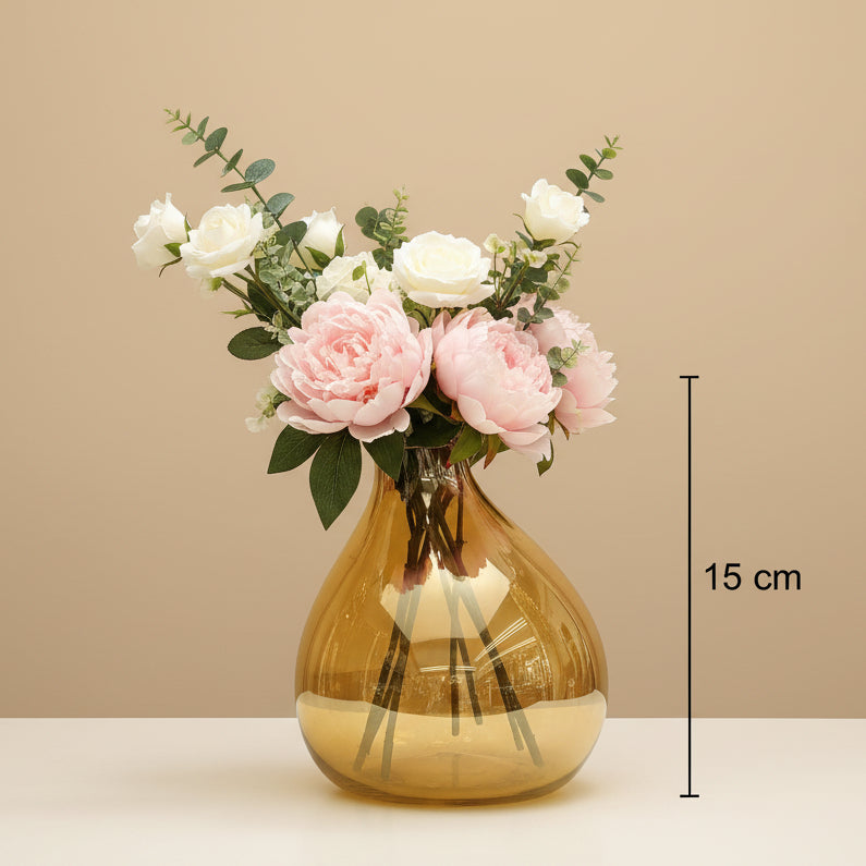 The smaller amber bubble vase marked 15 cm, holding peonies and white roses