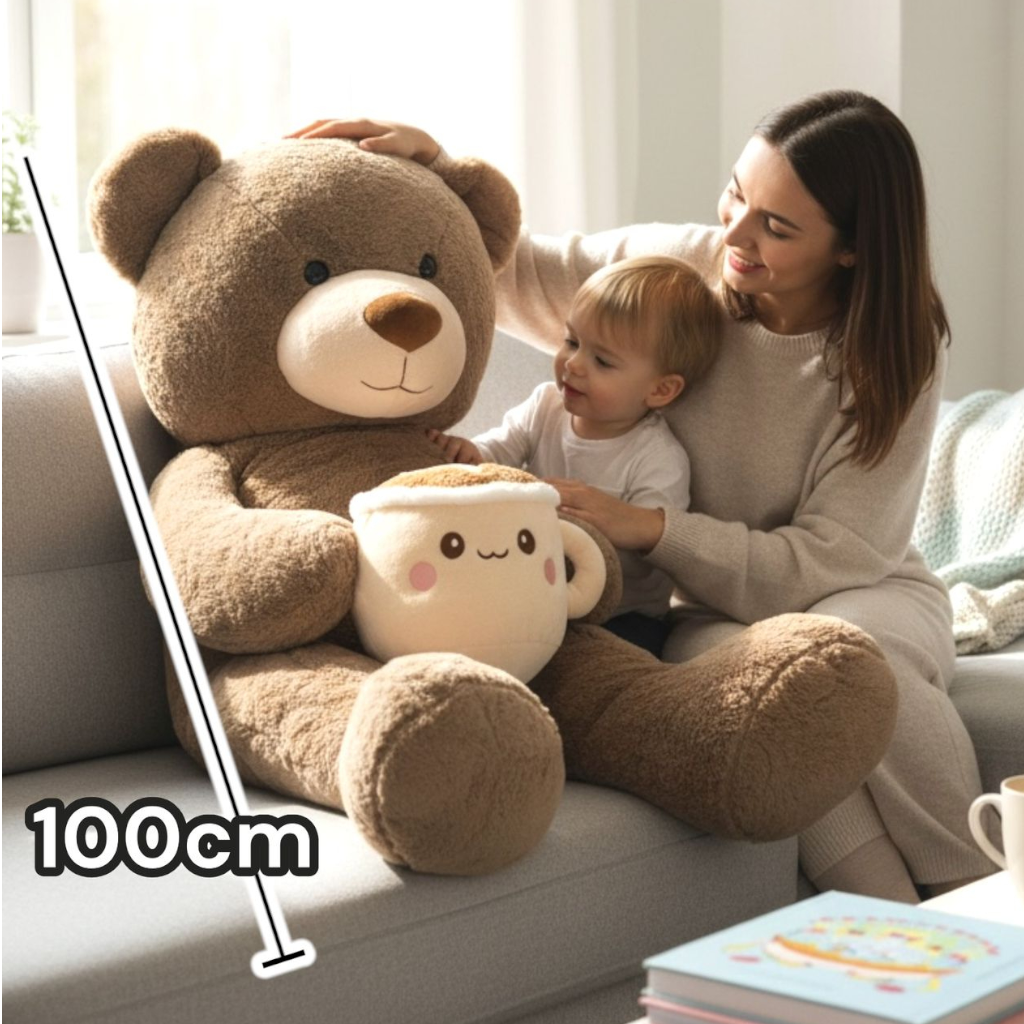 Brown bear with cream ear panels and a wide cream muzzle, its latte mug plush at rest in its lap