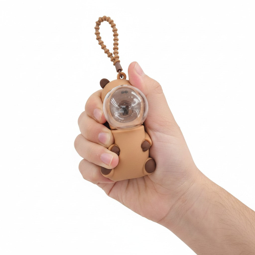 Capybara fidget keychain held in hand showing size