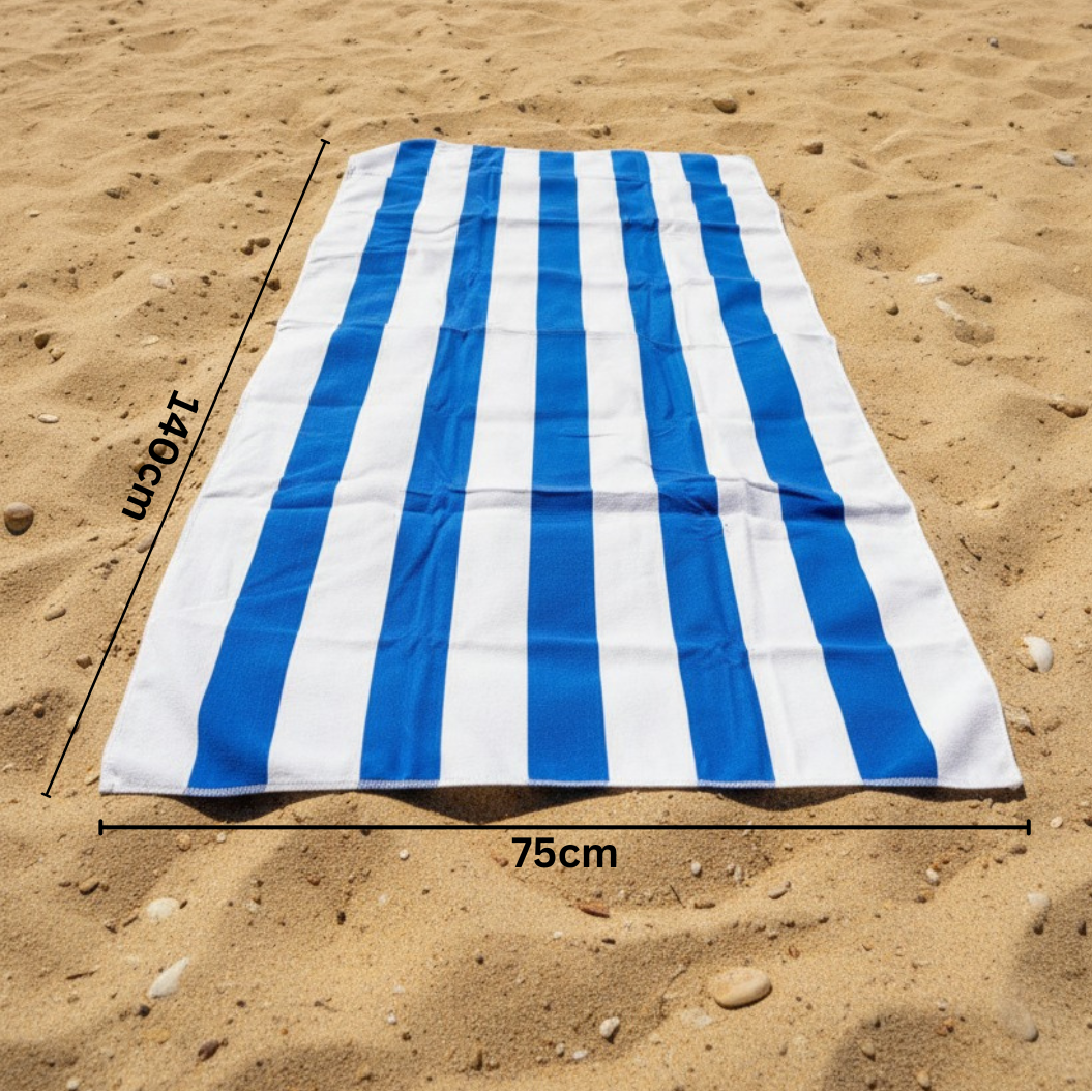 Dark blue and white striped beach towel on sand with 75x150 cm size measurements