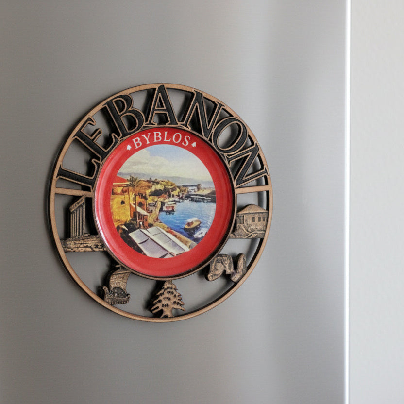 Copper medallion magnet ringed with landmarks around a view of the Byblos harbour