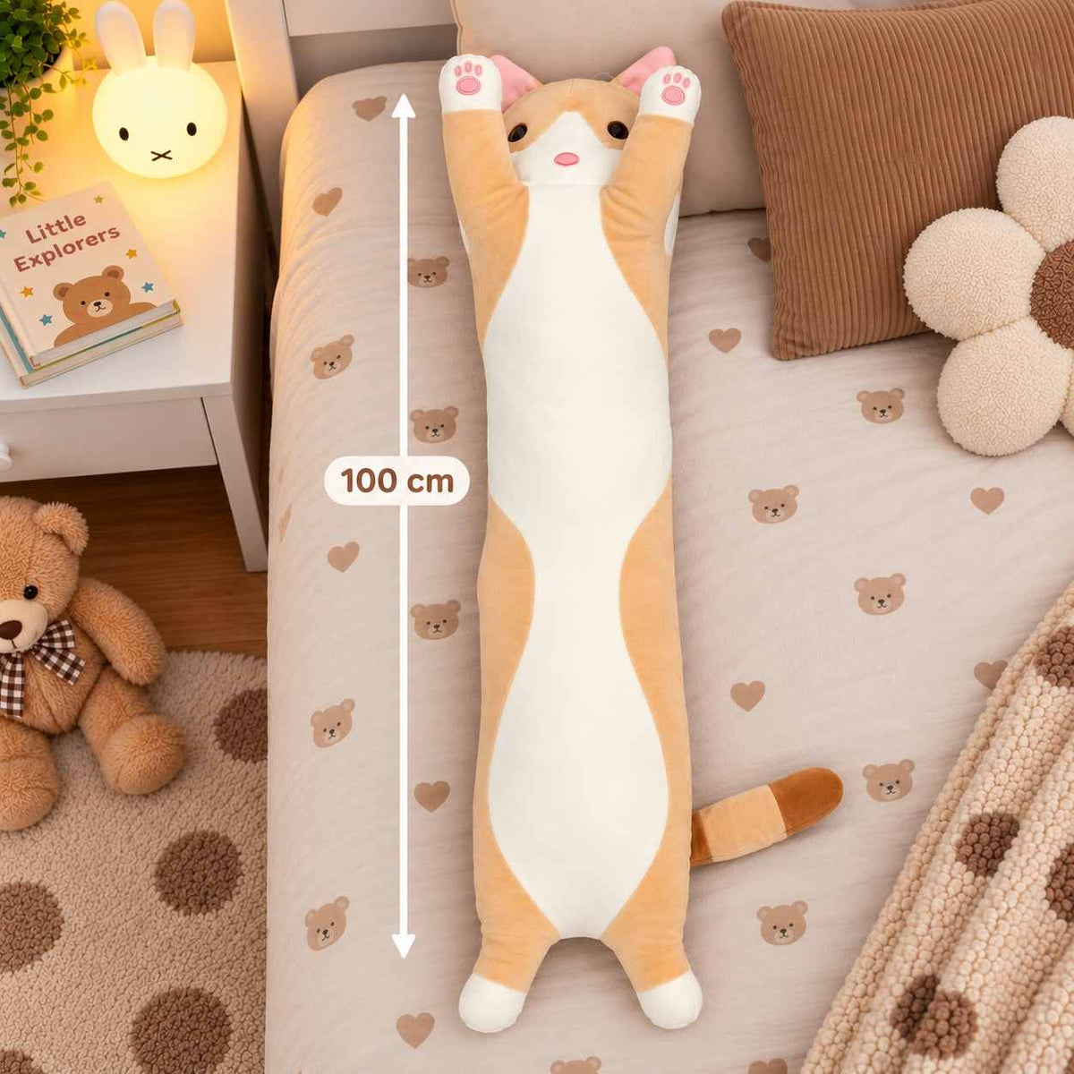 Ginger long cat body pillow plush on a teddy bear print bed with a 100 cm measuring line