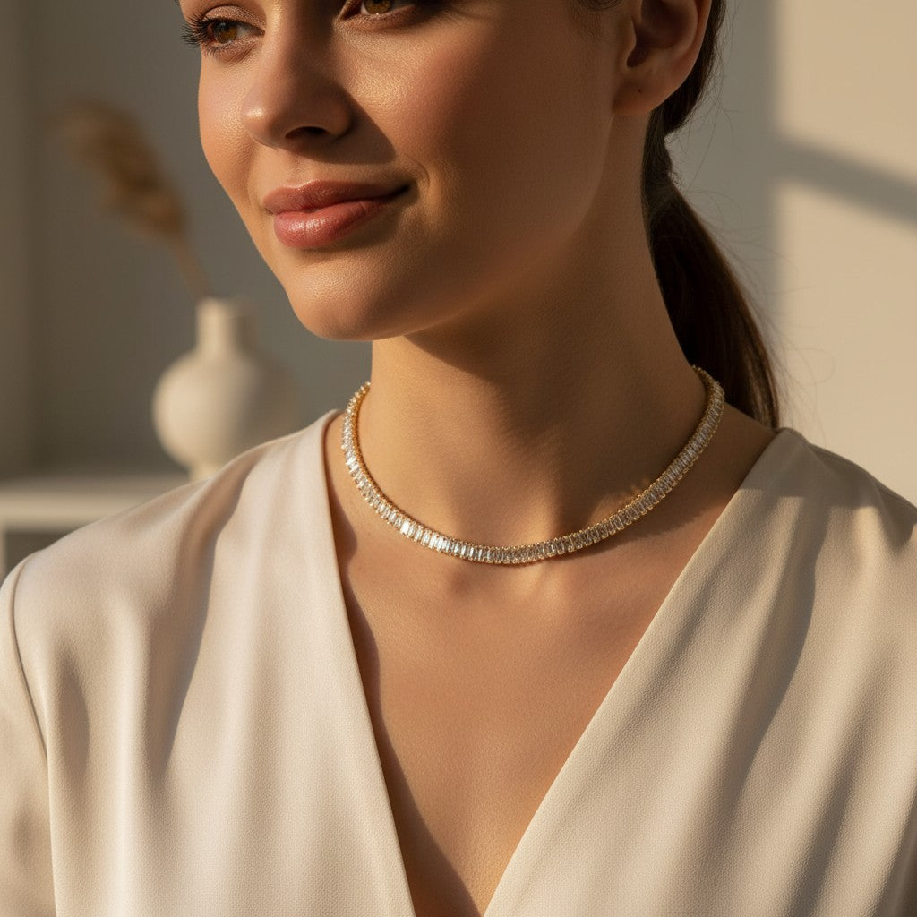 Woman wearing a diamond necklace in a softly lit room