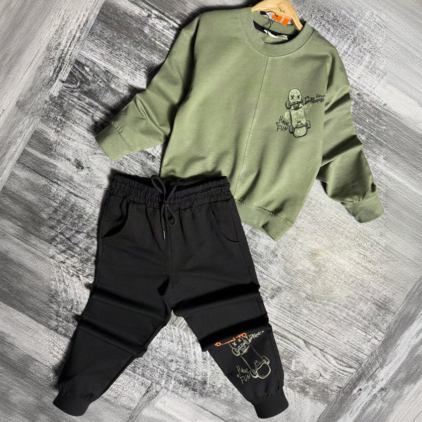 Green skateboard sweatshirt and black joggers on a hanger, front view