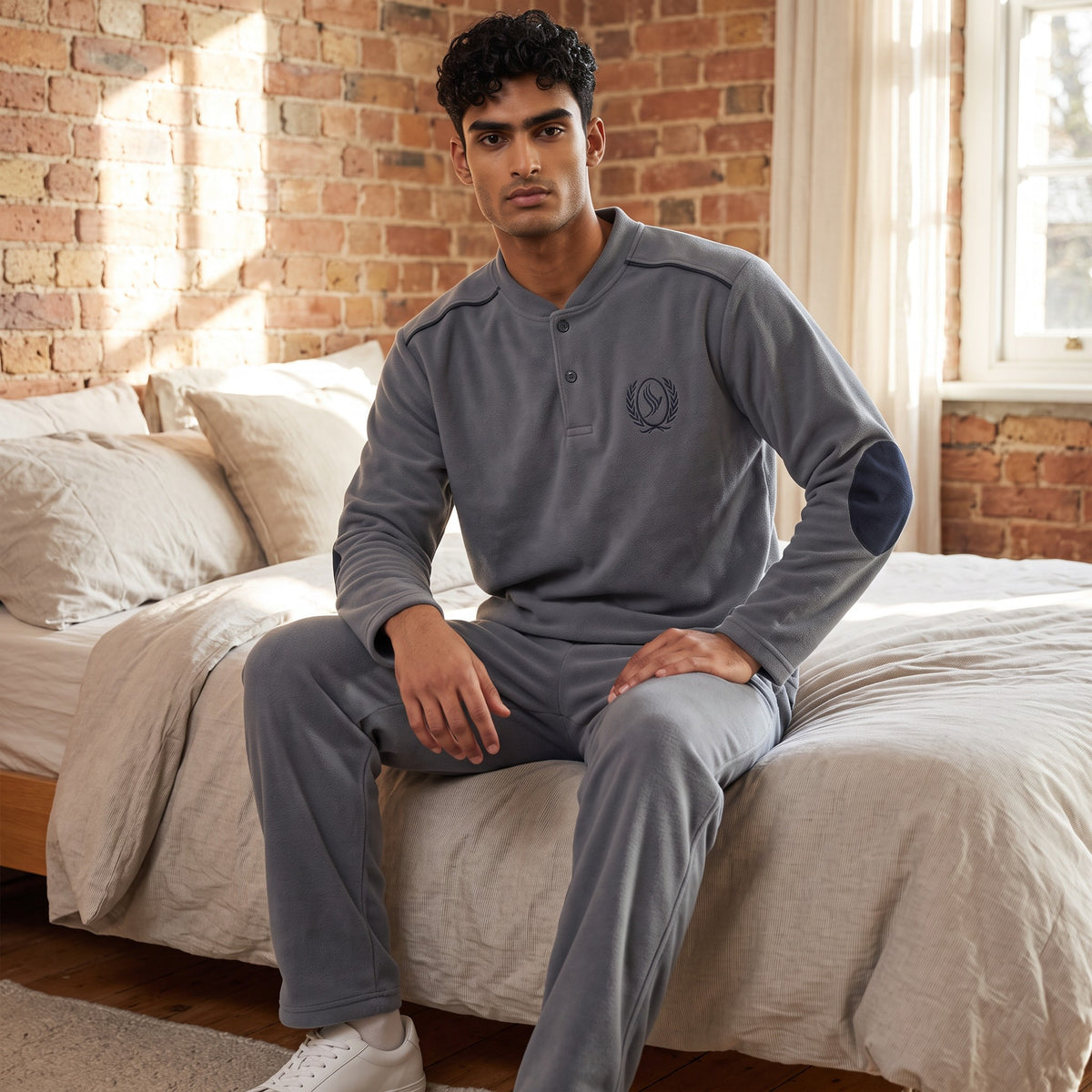 Men's grey fleece henley pyjama set with navy elbow patches and shoulder piping