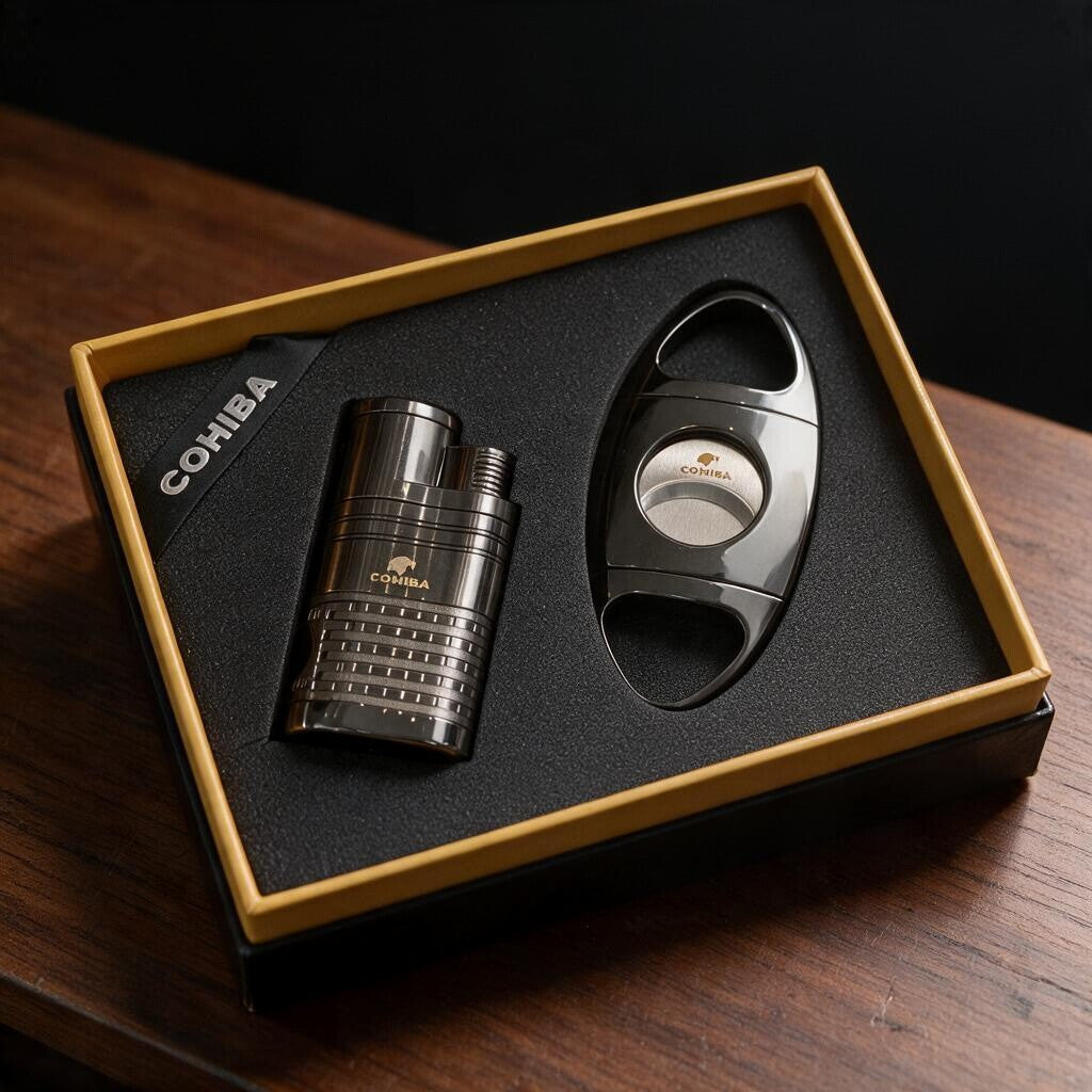 Ribbed gunmetal cigar lighter and polished oval cigar cutter in a gold edged gift box
