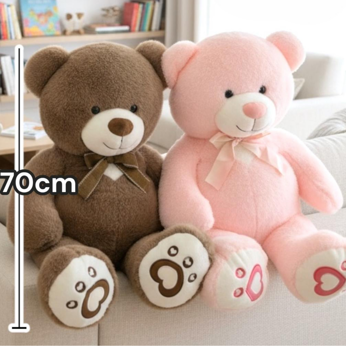 Brown and pink huggable teddy bears seated together beside a 70cm measuring line