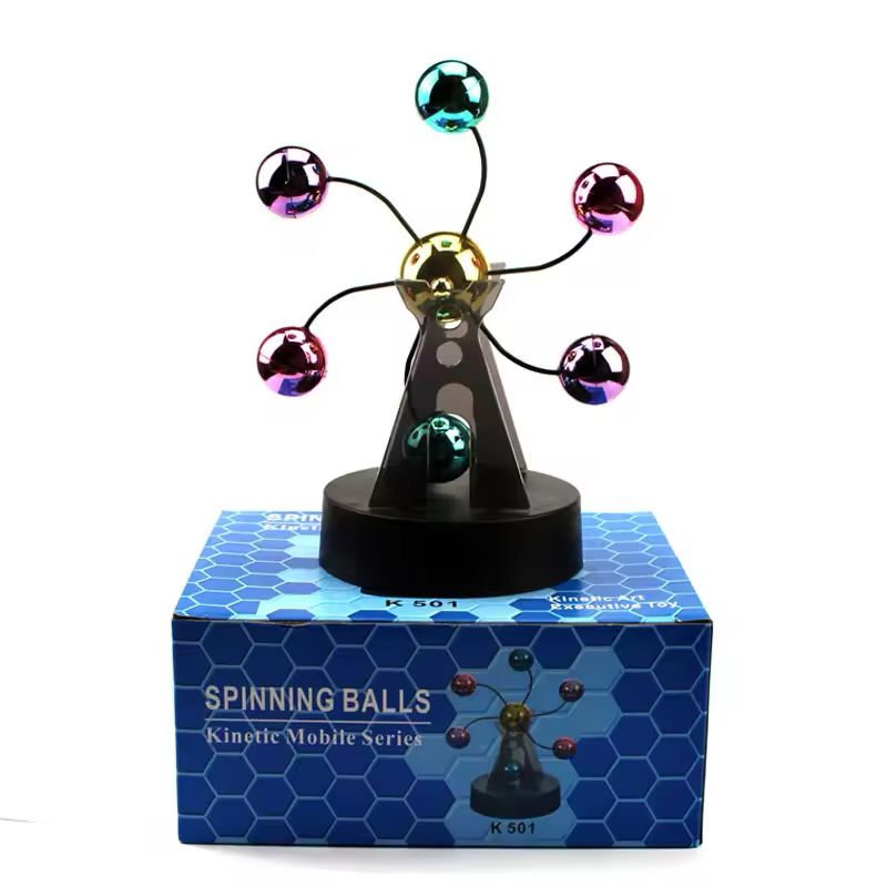 Kinetic desk gadget standing on its blue honeycomb patterned retail box