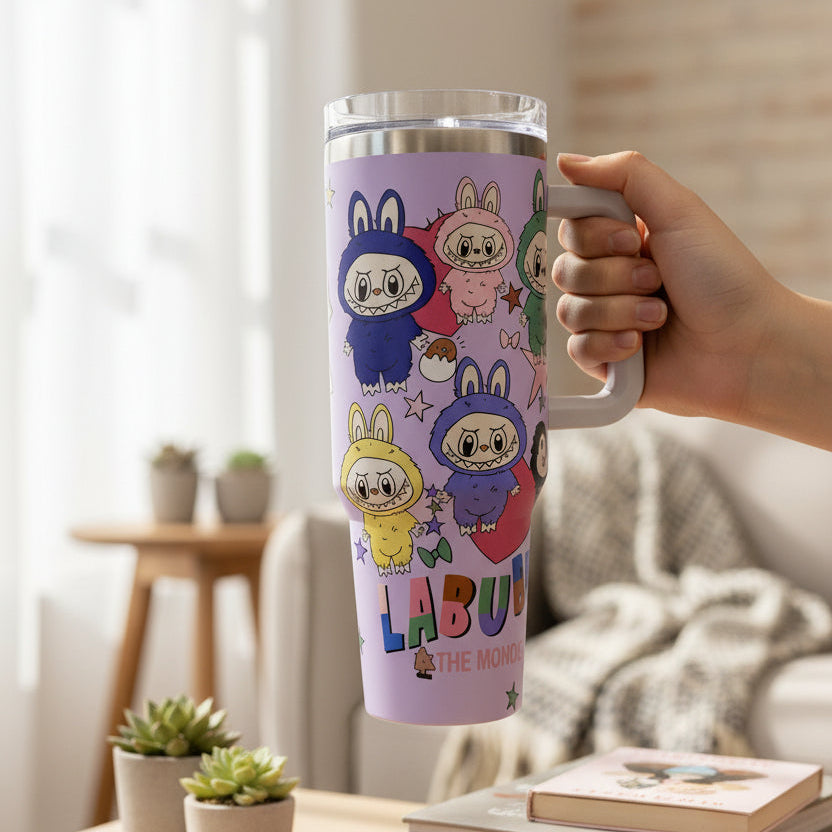 Lilac tumbler with a side handle printed with six Labubu characters