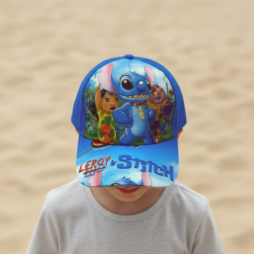 Boy in a grey shirt wearing an all blue kids cap covered in colourful cartoon character art