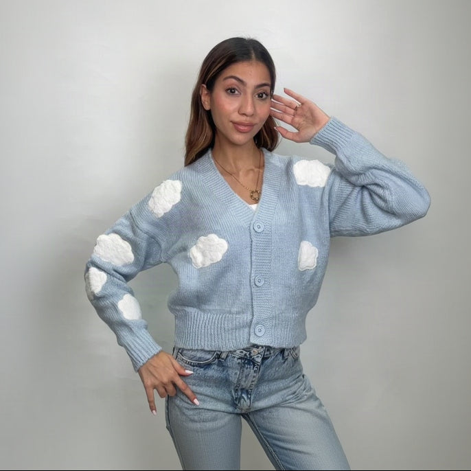 Baby blue V neck button cardigan with white 3D clouds on the body and sleeves