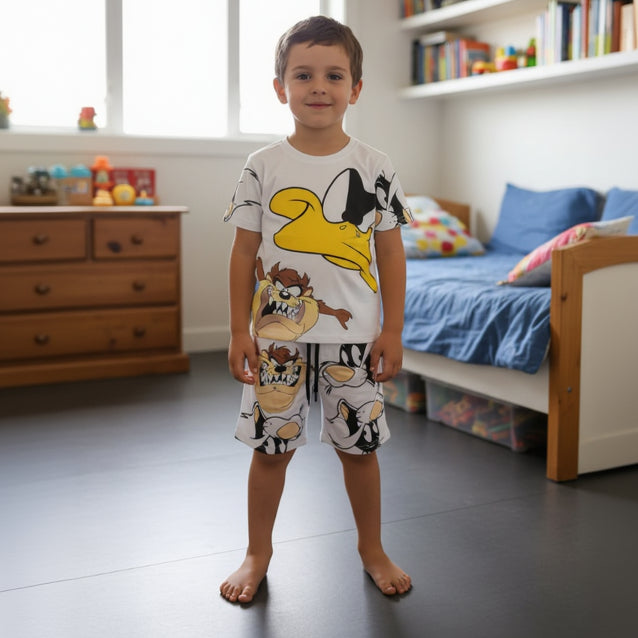 White boys set with a yellow Daffy Duck tee and shorts covered in Taz and Sylvester faces