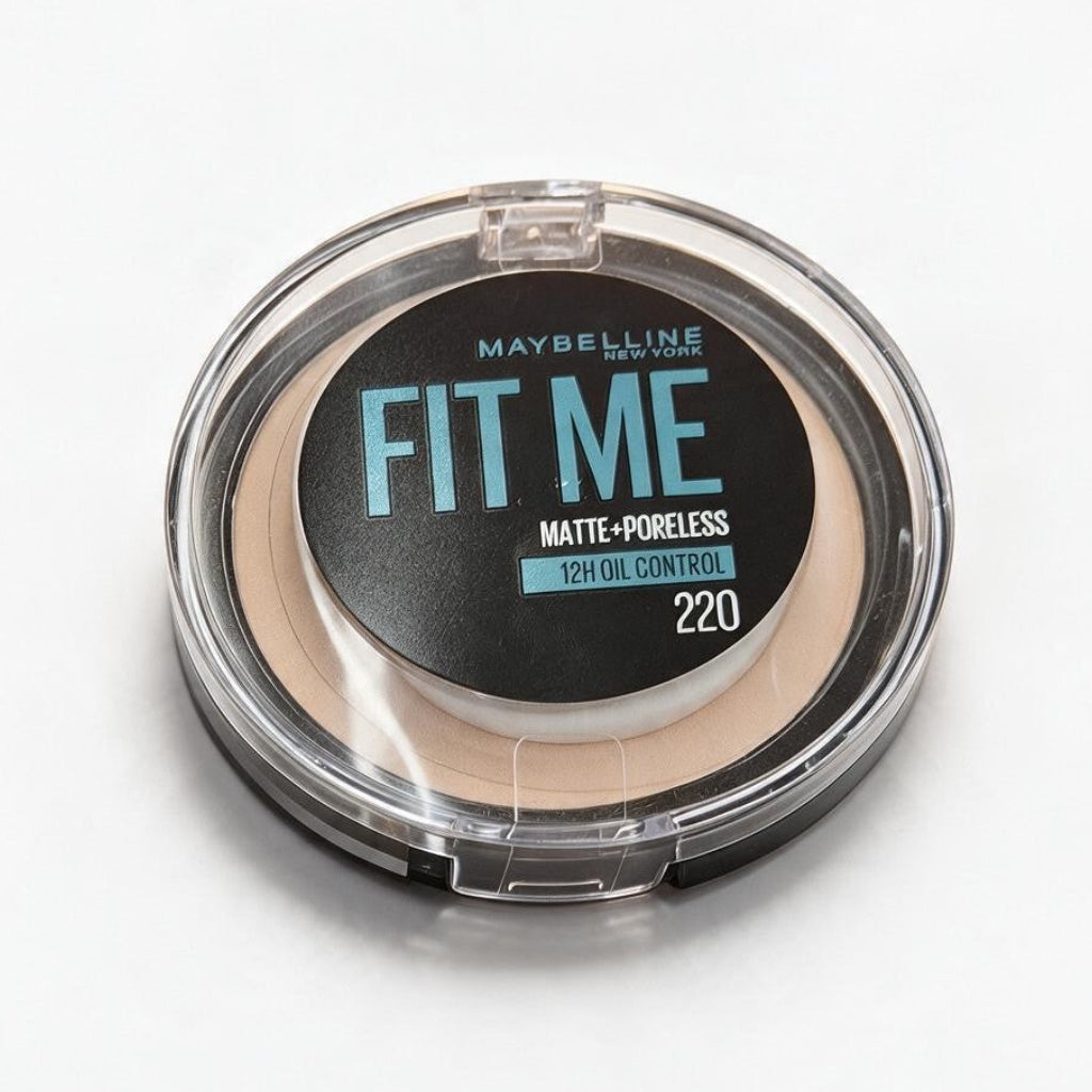 Maybelline Fit Me Matte Poreless pressed powder in shade 220, a compact with a clear lid on a white surface