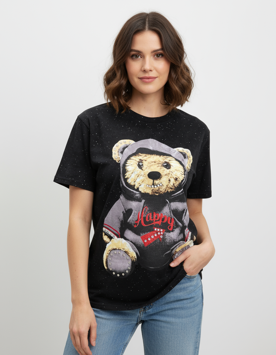 Woman wearing a black tshirt with a teddy bear graphic design on a plain background