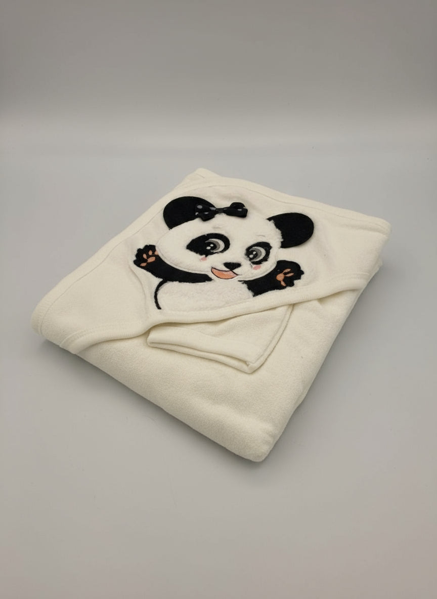 Cream fleece hooded baby towel folded with a black and white panda applique on the hood