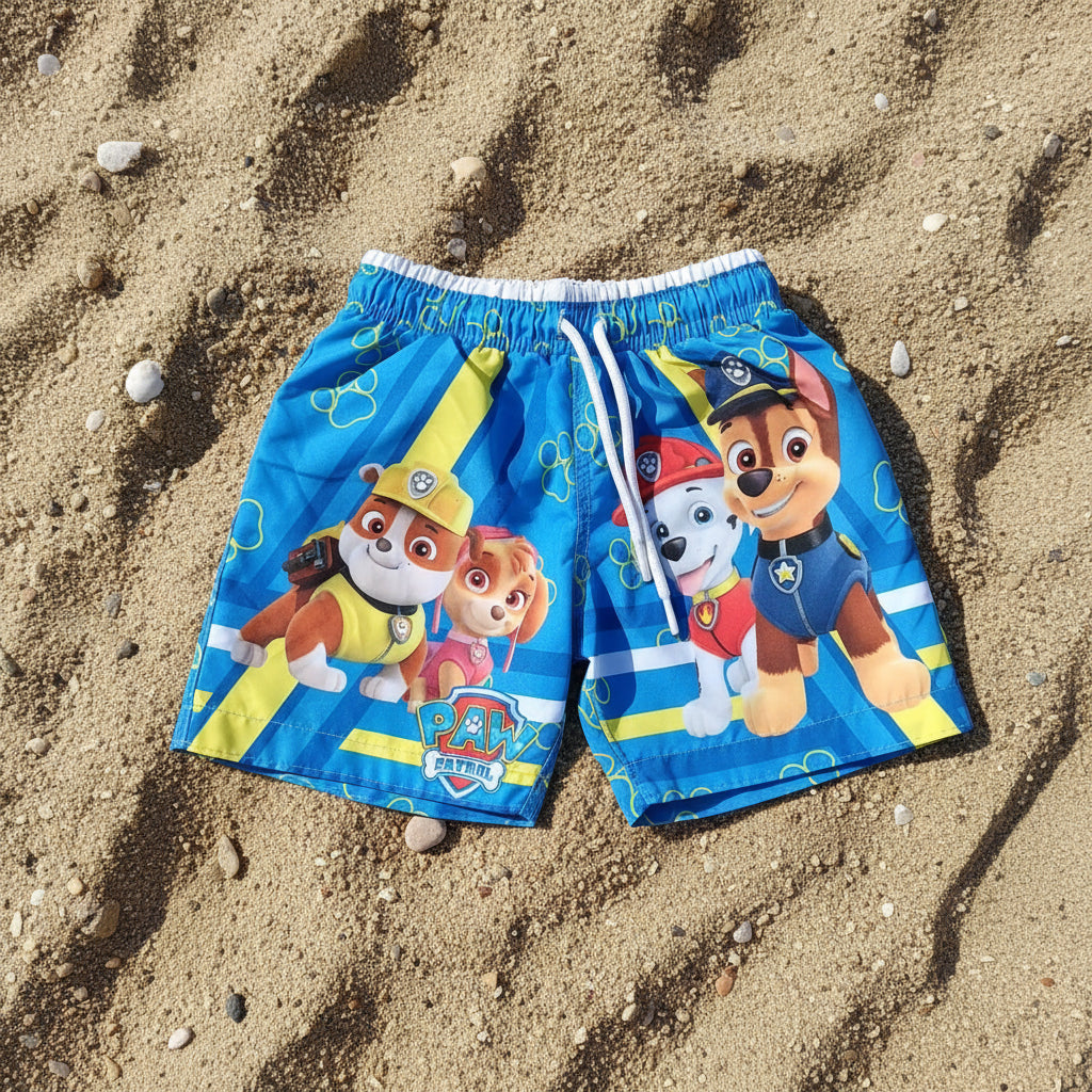 Children's swim shorts with Paw Patrol characters on sand