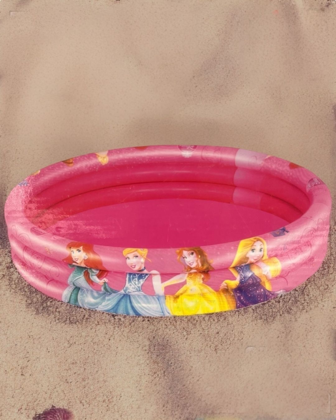 Pink three ring inflatable paddling pool printed with four fairytale princesses in ball gowns