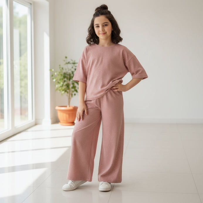 Girl in a dusty rose sparkle tee and matching wide leg pants