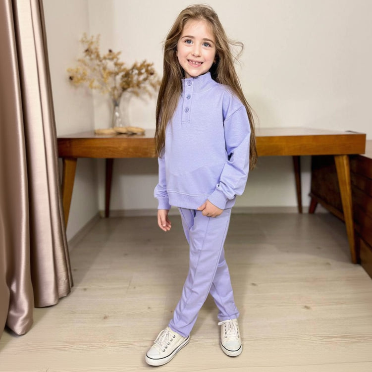 Girl in a lilac button placket sweatshirt and matching pants
