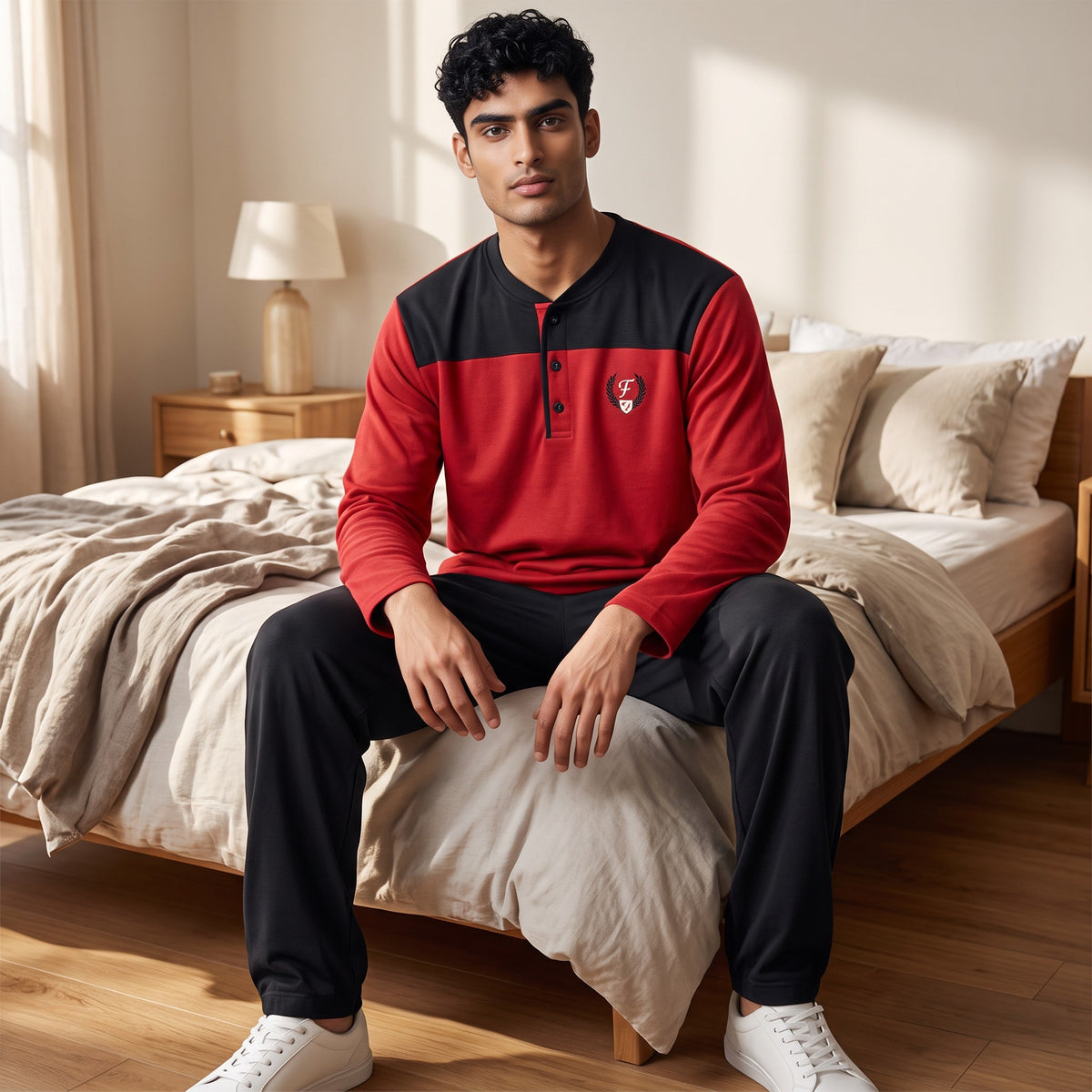 Men's red henley pyjama top with a black shoulder yoke and black bottoms