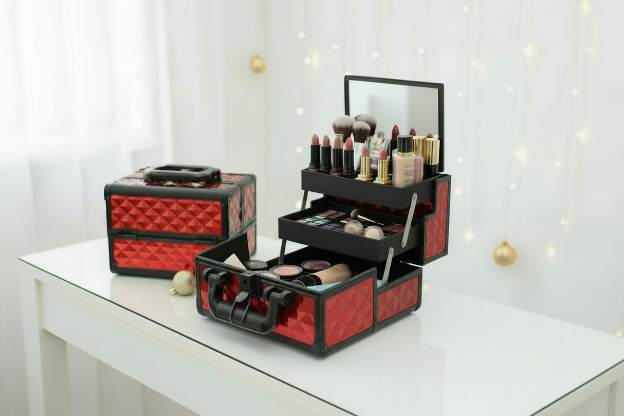 Red studded aluminium vanity case open with a lid mirror and tiered trays of makeup