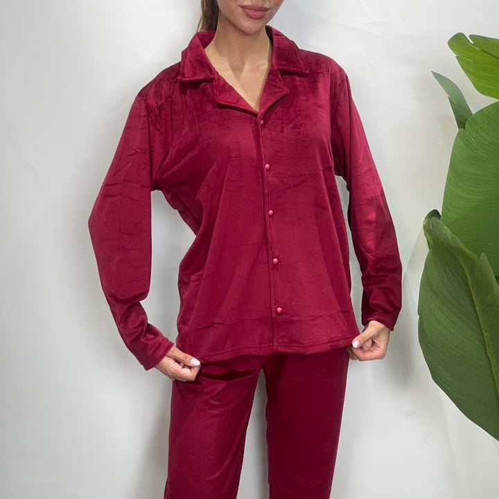 Close up of a deep red velvet pajama shirt with notch collar and button front