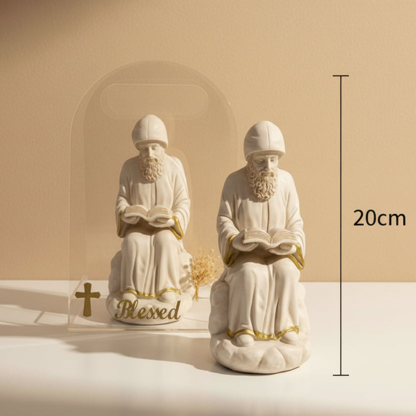 Two seated reading monks and a clear arch lettered Blessed in gold, marked 20cm