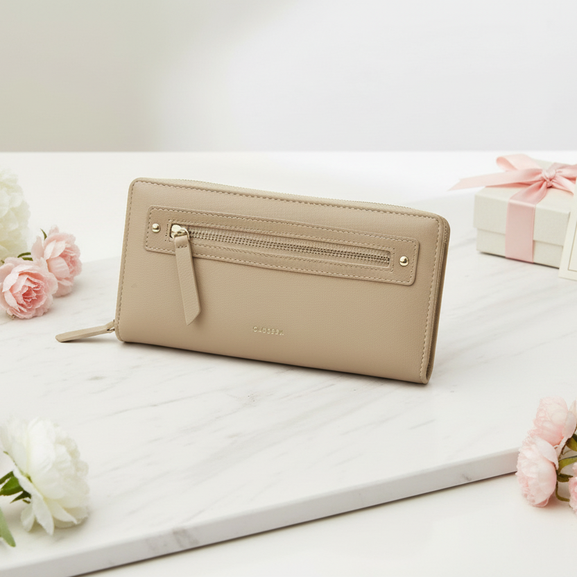 Beige women's wallet with a sleek gold zipper detail