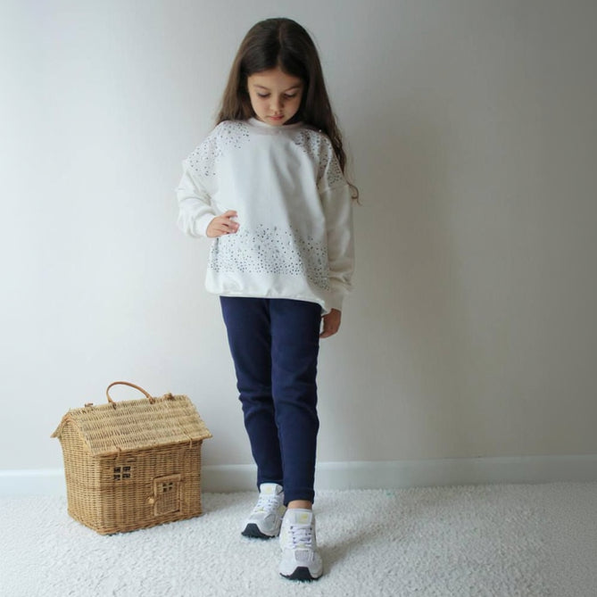Cream sweatshirt with sparkle detail across the shoulders and hem