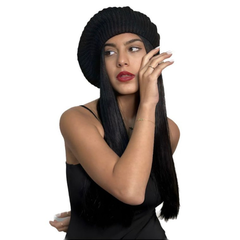 Black wool beret worn tilted with a black top