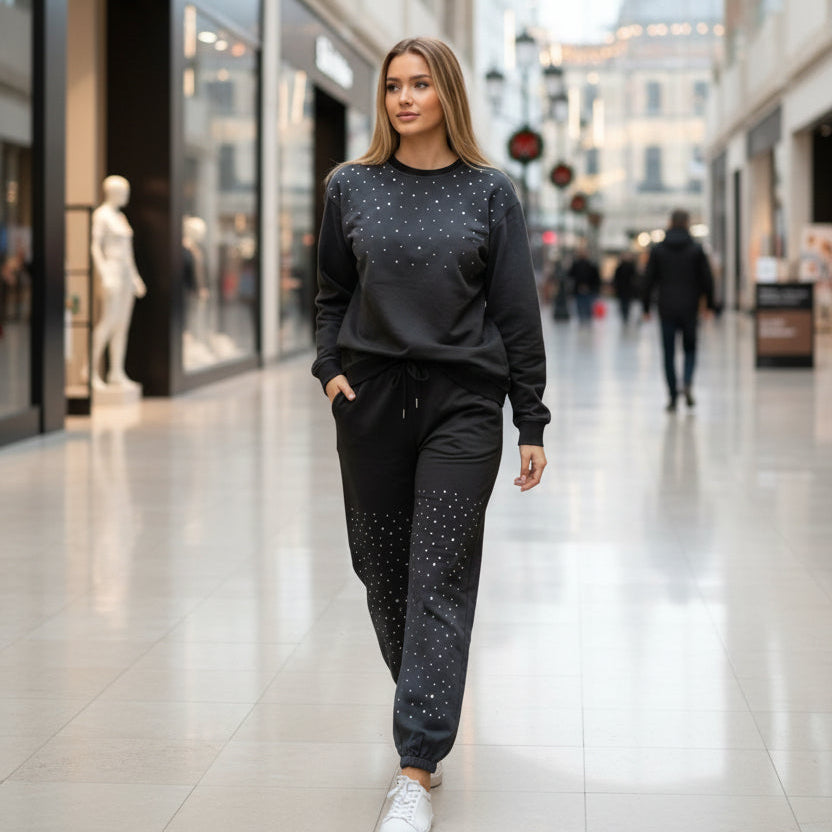 Woman in a sparkly sweatshirt and pants walking through a shopping mall