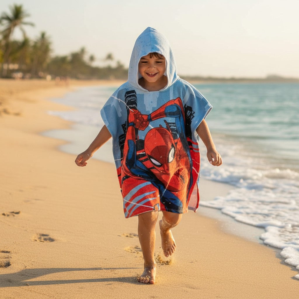 Boy running in a Spider-Man city hooded poncho towel – Jack Gifts Online Lebanon