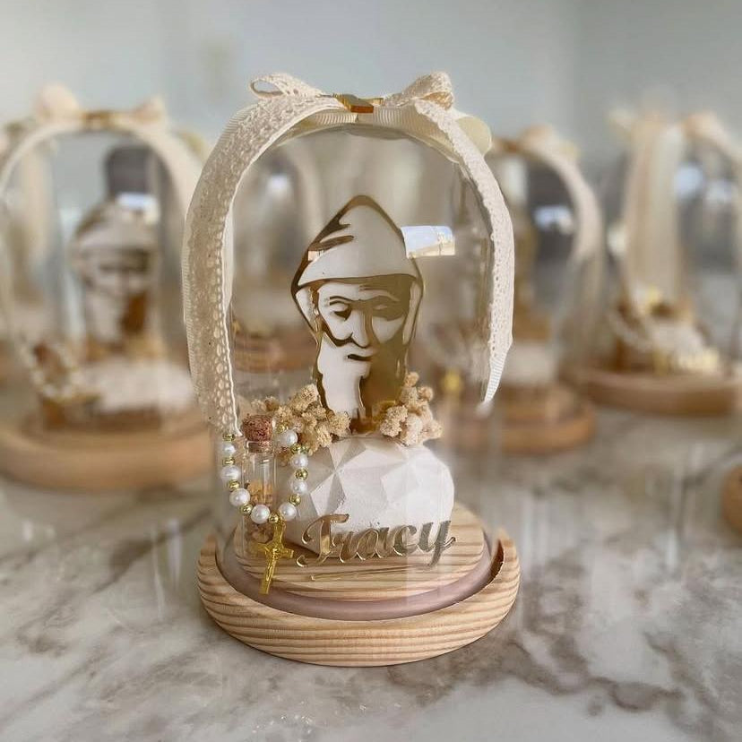 Laser cut portrait of the saint on a faceted crystal block with a pearl rosary