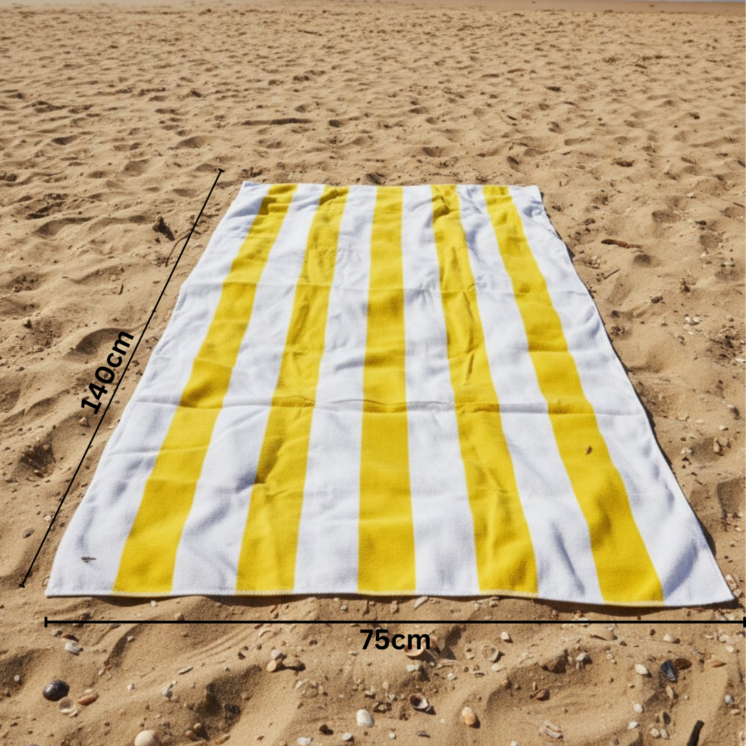 Yellow and white striped beach towel on sand with 75x140 cm size