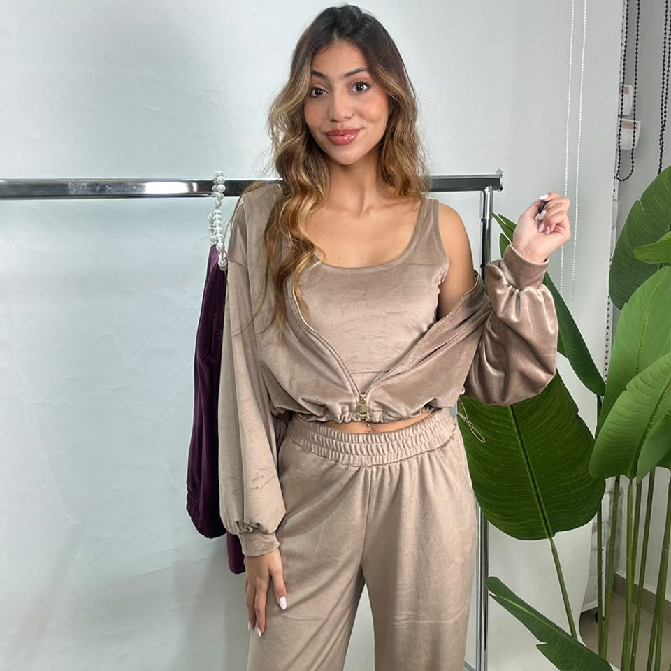 Taupe velvet three piece set worn by a rail with the jacket draped on the arms