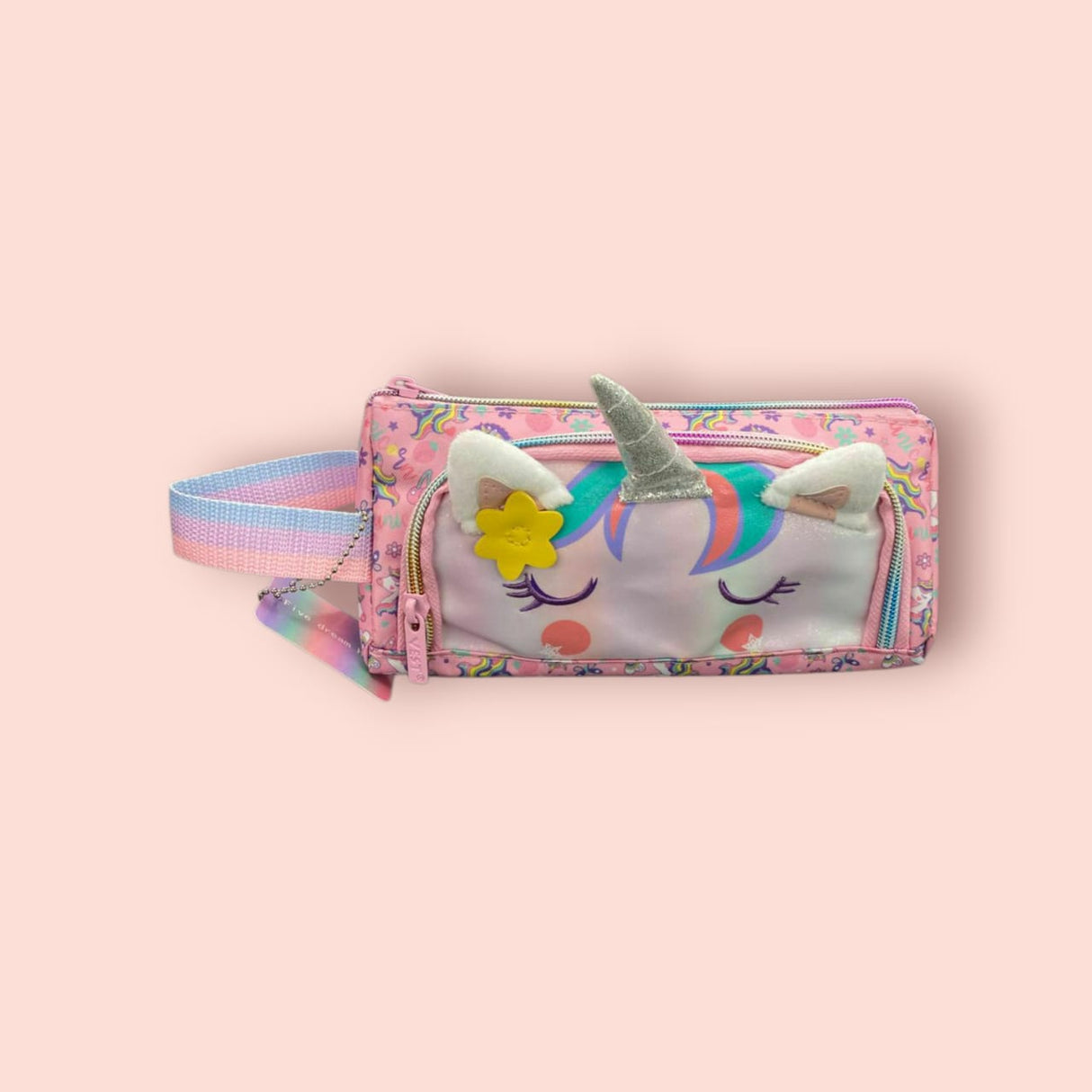 Unicorn-themed pouch with colorful design on a pink background