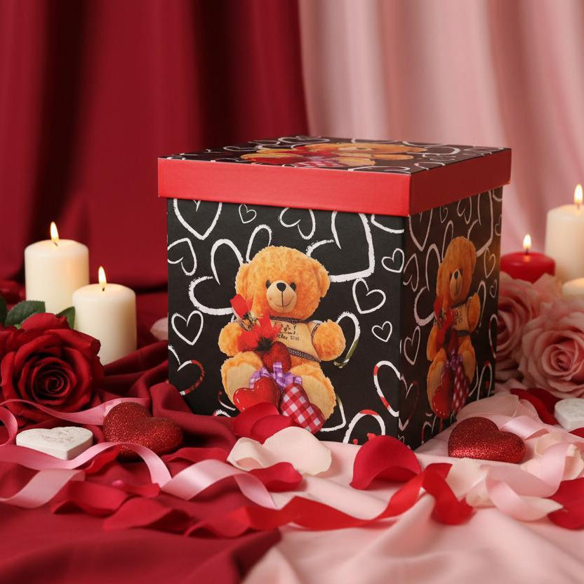 Black gift box with red hearts and a teddy bear print