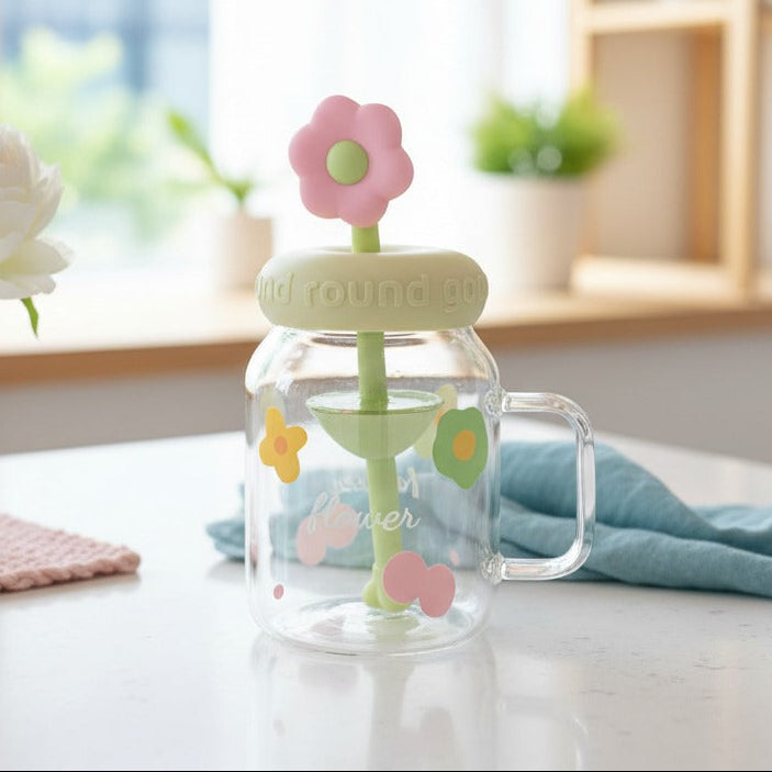 Clear jar with a pink flower-shaped lid on a table with a blurred background