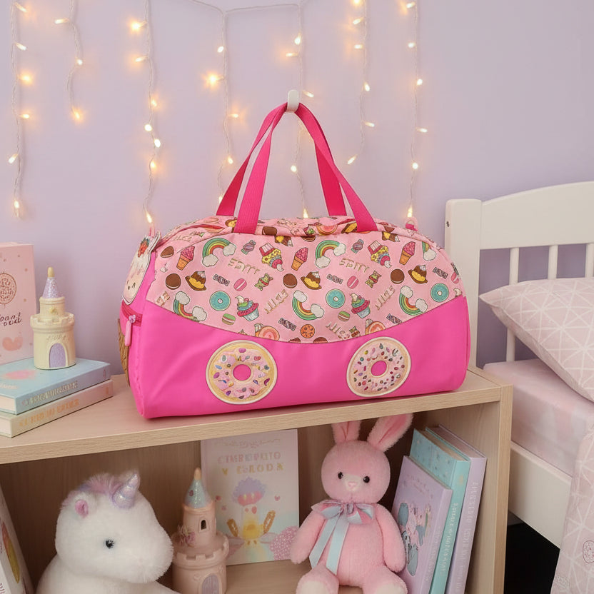 Pink duffel bag with candy-themed design on a wooden shelf in a child's bedroom.